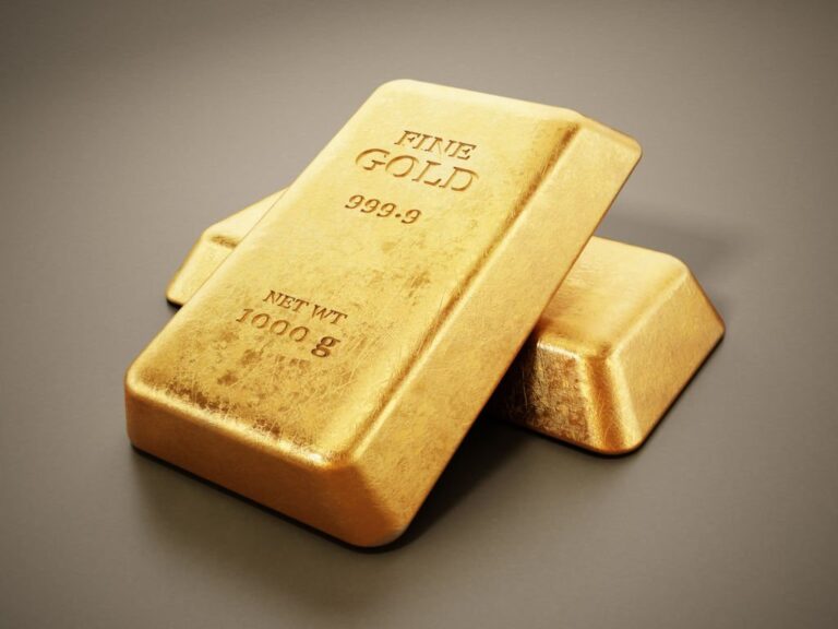 1 kg gold ingots standing on gray background