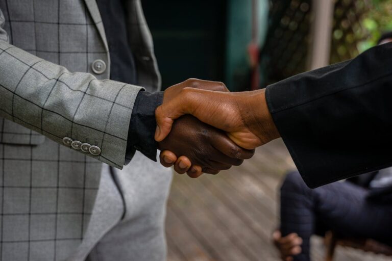 people shaking hands: you need a lawyer for mediation